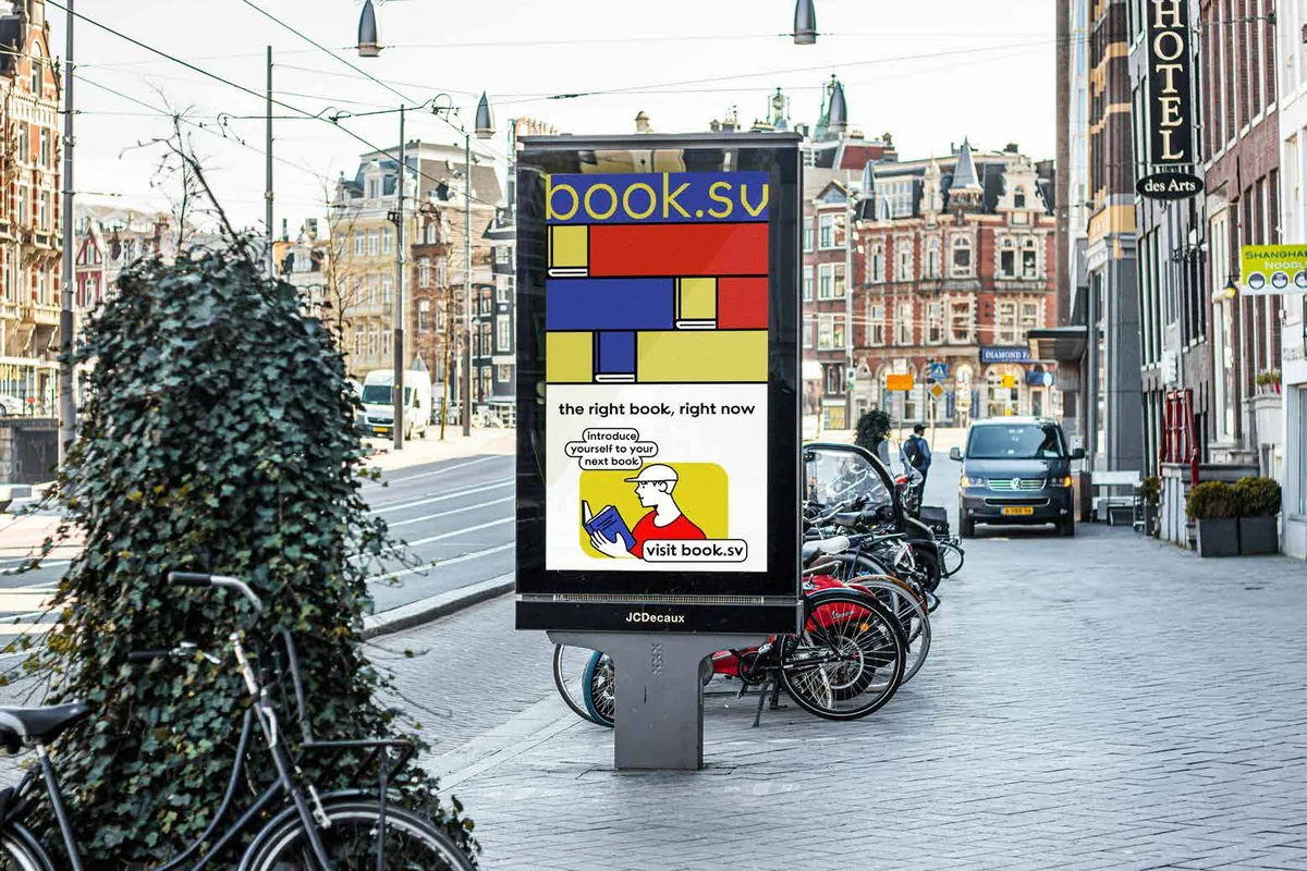 Book.sv poster on a street-side sign